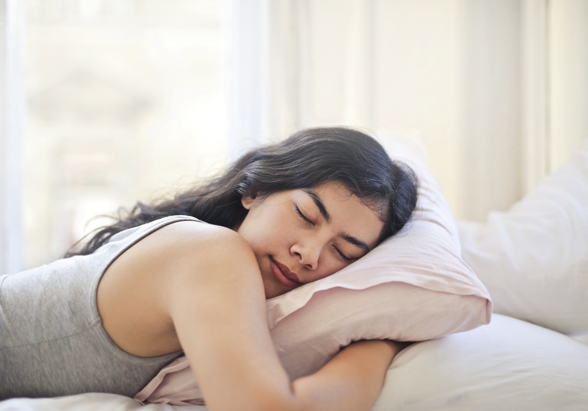 Woman sleeping on her stomach, drools during sleep
