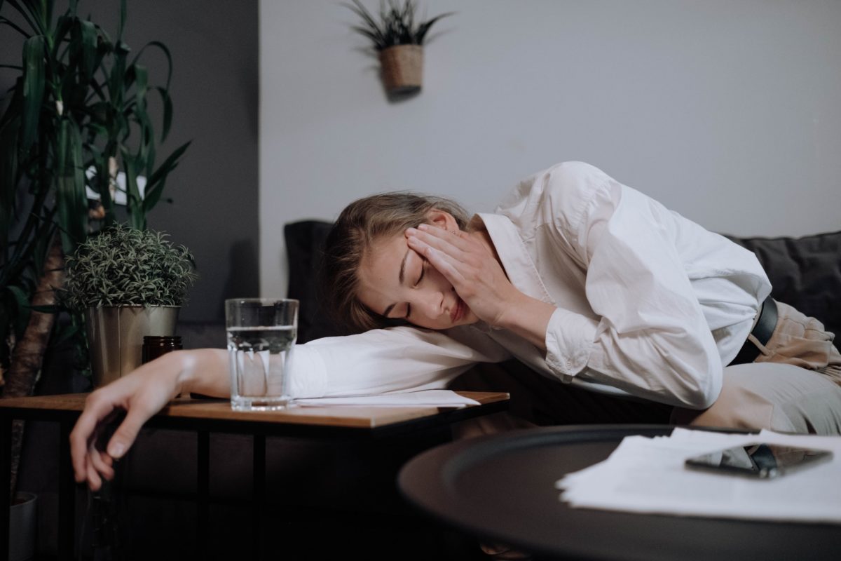 Woman sleeping during the day due to practicing bad sleep habits
